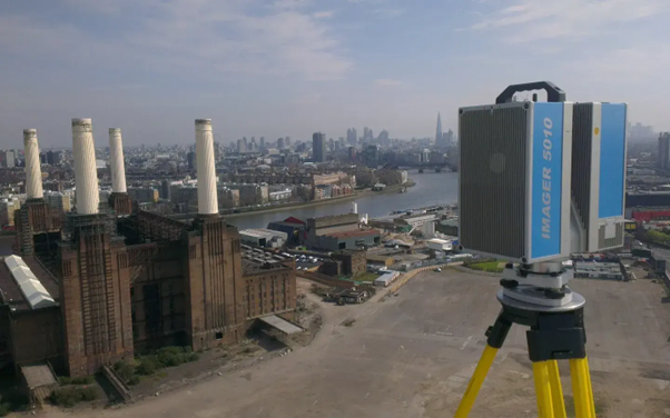 3D laser scanning equipment positioned overlooking an industrial city site during a 3D laser scanning survey for accurate site mapping.